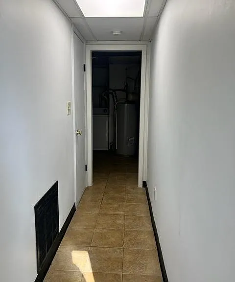 washer and dryer located to your right upon entering the door