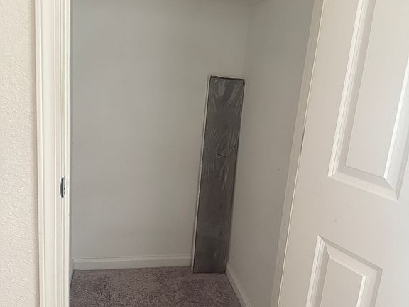 Downstairs storage, below the stairways.