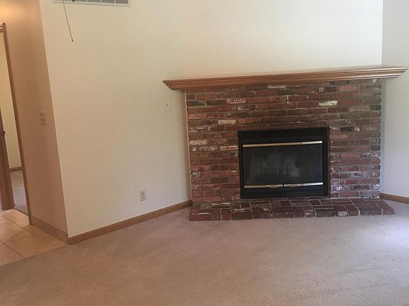 LIving room with fireplace and vaulted ceilings
