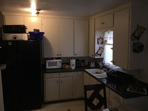 Kitchen area, stove area is to the left.