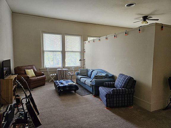Living Room with Large Windows, Lots of Natural light. Open concept with 3/4 walls.