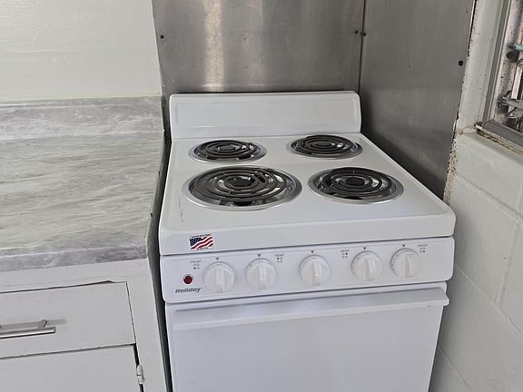New apartment four burner stove
