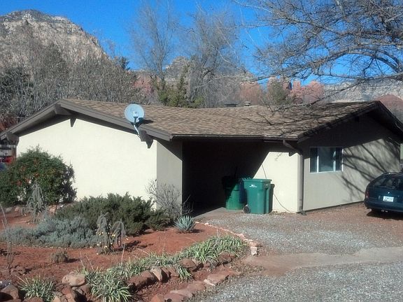 Front of house showing carport