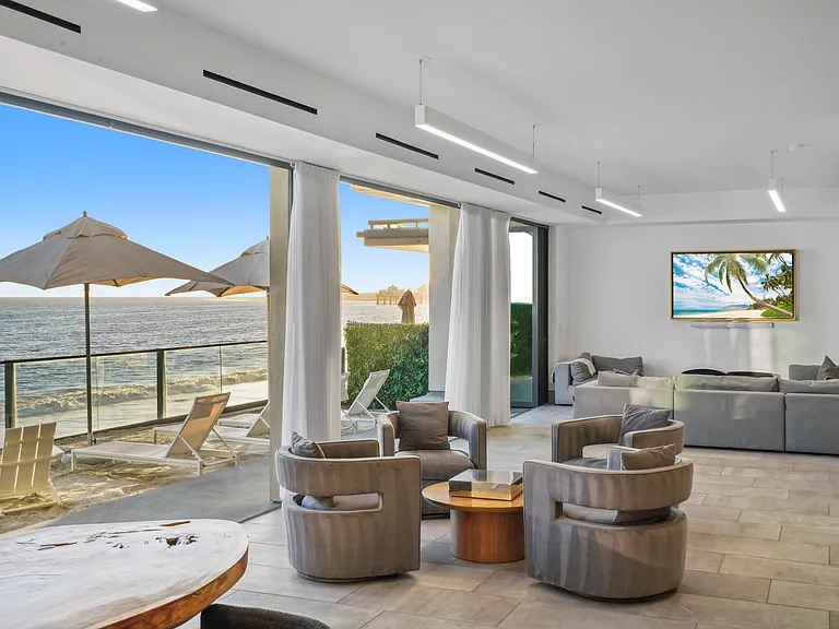 Indulge in quiet moments by the window as the ocean breeze drifts in.