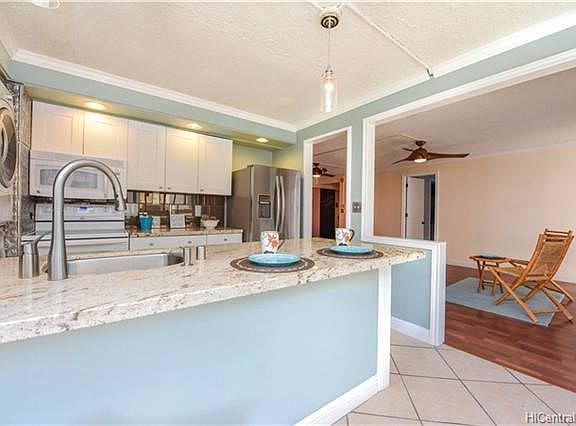 Kitchen opens up to the dining and living area.