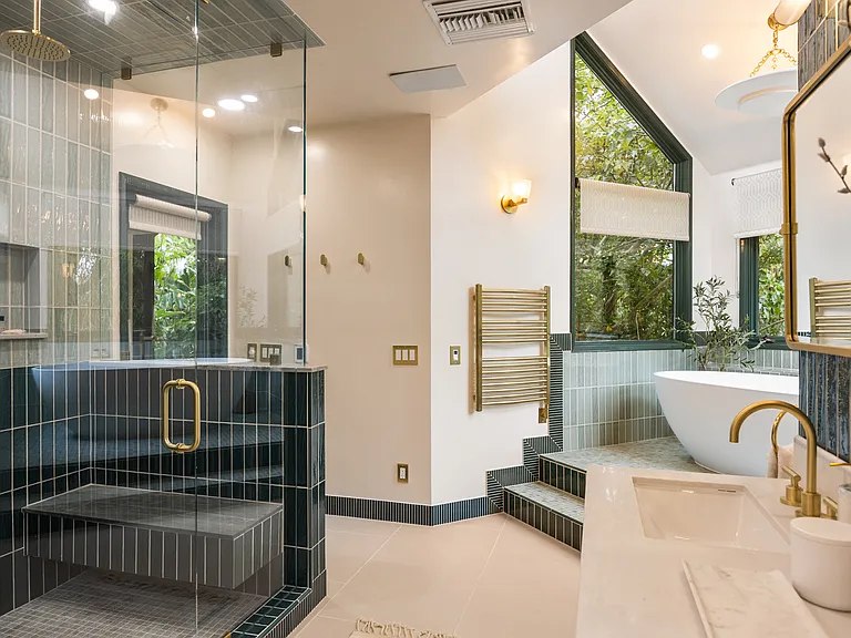 Bright and airy master bathroom with plenty of natural light and chic decor.