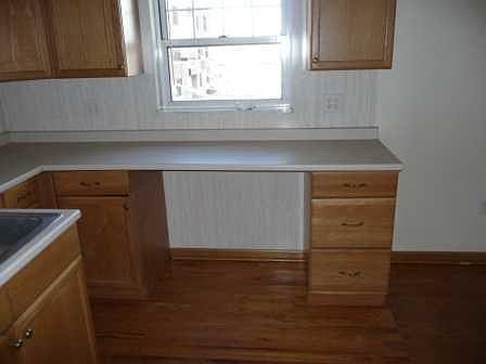 This photo shows a close up of space for eating or turning into an office space with natural light.