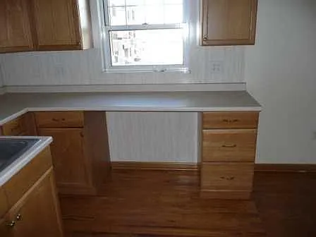 This photo shows a close up of space for eating or turning into an office space with natural light.
