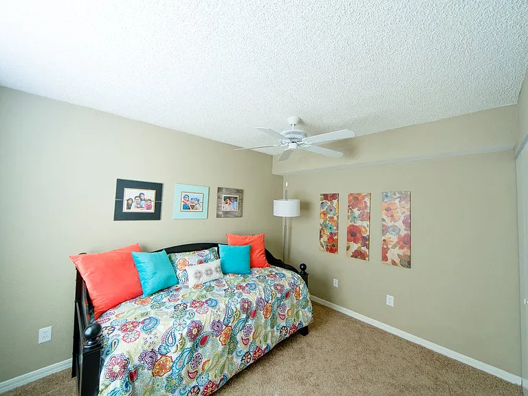 Bedroom with a ceiling fan at Gregory Cove in Jacksonville, FL