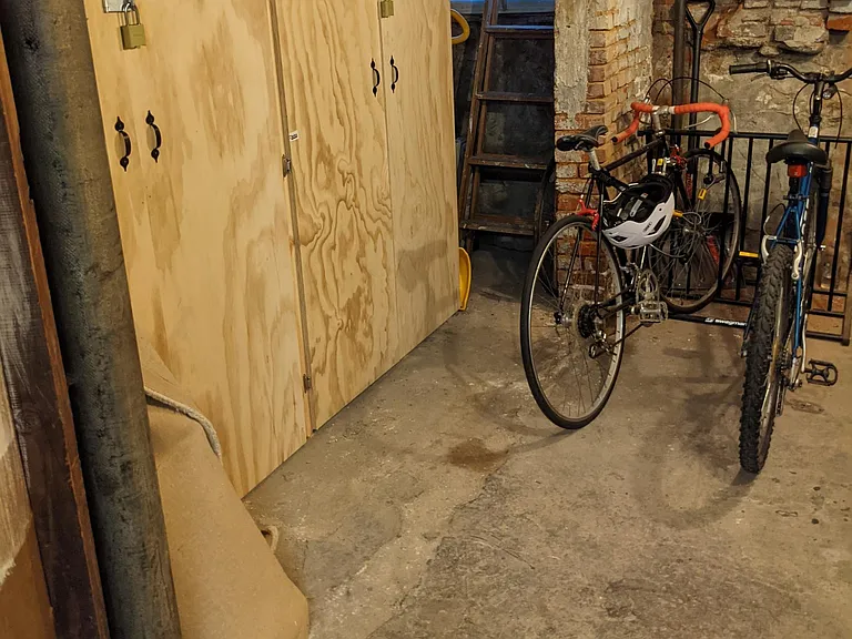 Bike rack in locked room + private locked storage units