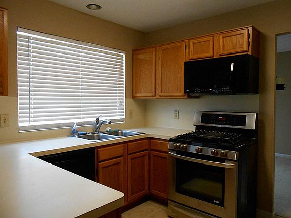 Watch the kids play in the large backyard from your kitchen window.