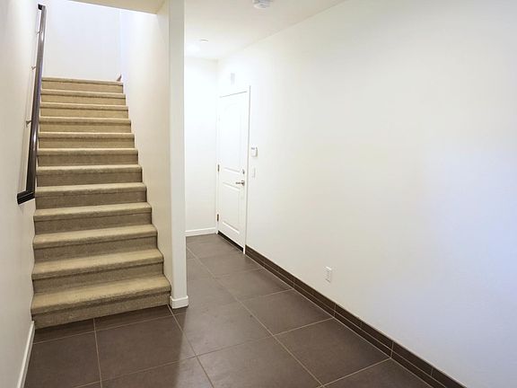Entrance foyer to garage and stairs to 2nd level.