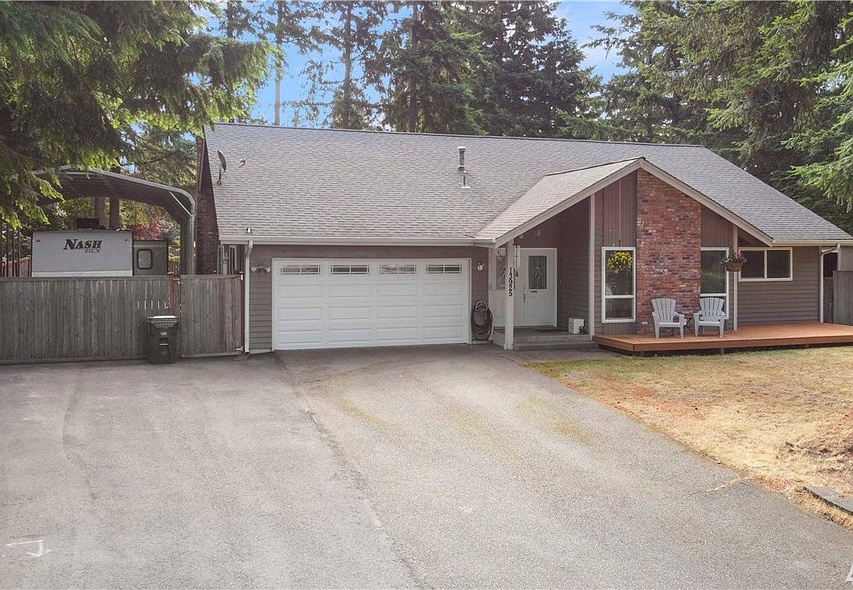Front of home, extra parking space, RV parking and new front sitting porch.