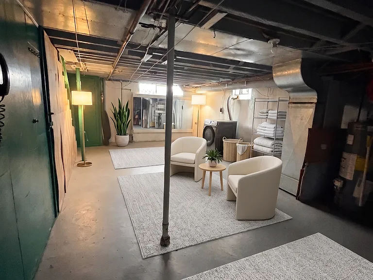 basement with 2 washers and 2 dryers for each unit.