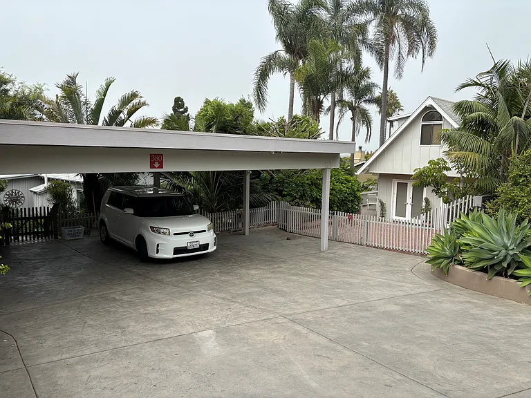 Carport parking is close to Guest House entry.