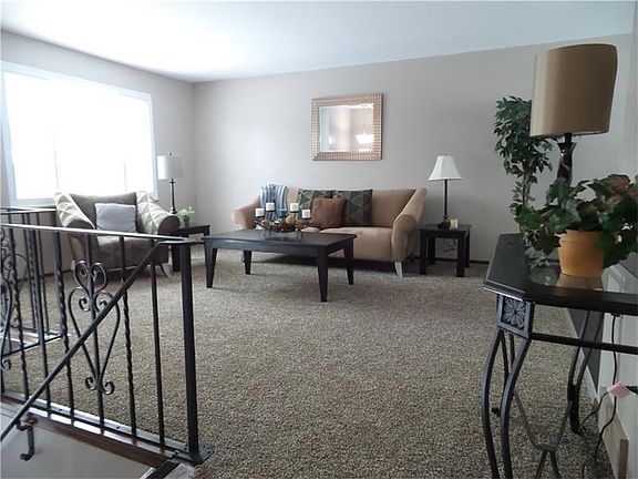 Open concept - large living room that leads into the dining room and kitchen. New carpet and floorin