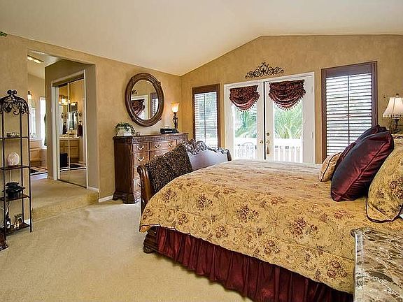 Master Suite with balcony and designer paint, drapes