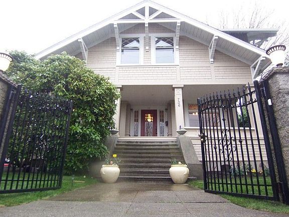 Sequestered behind gated fence and above street for privacy, this lovely classic has a walk score of