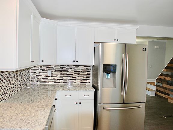 Kitchen with new appliances, back splash, granite counter, new cabinets and floors