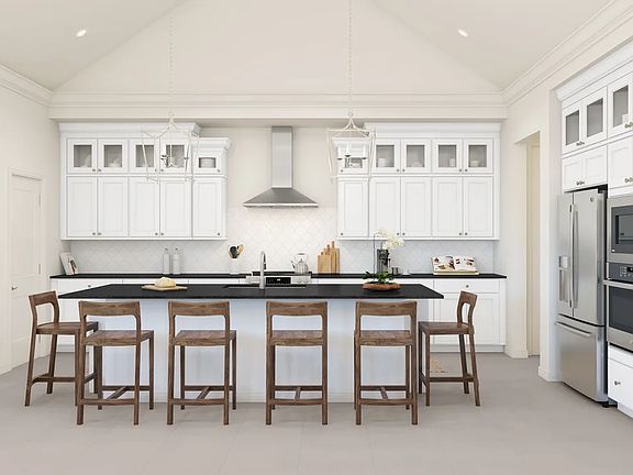 Kitchen with vaulted ceiling and glass upper cabinets