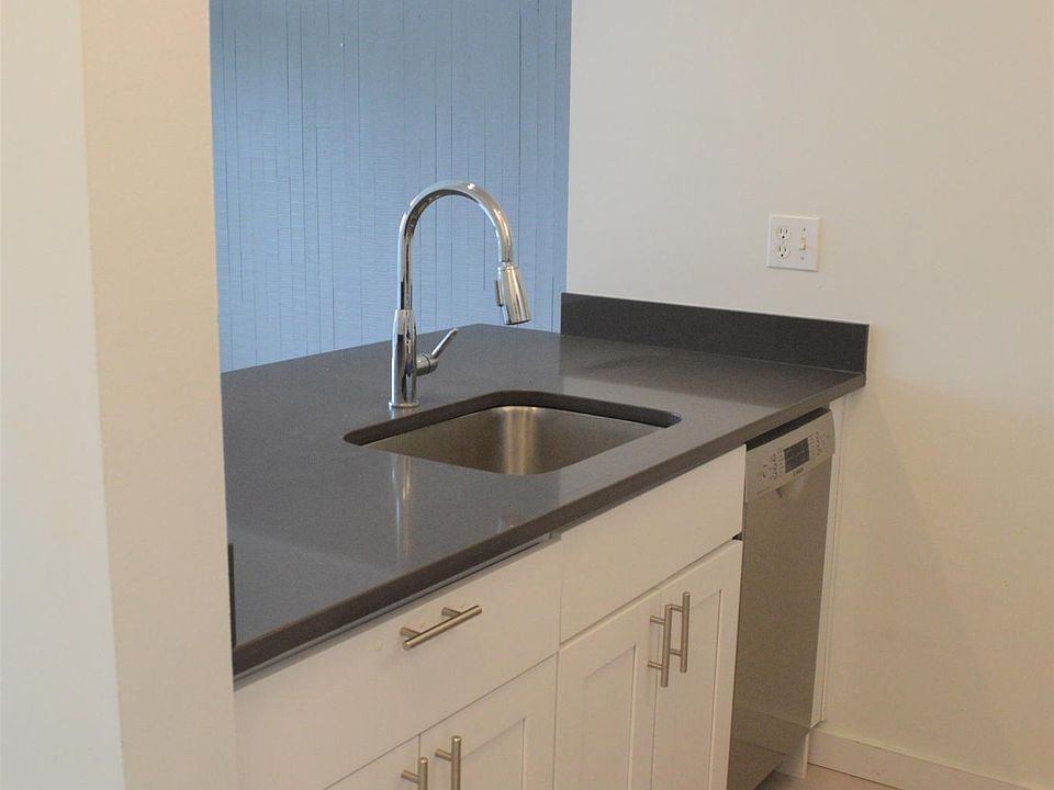 Kitchen area with sink and dishwasher