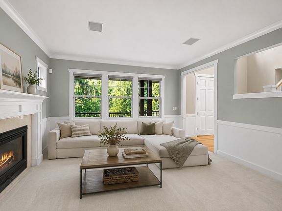 Spacious living area featuring a warm gas fireplace