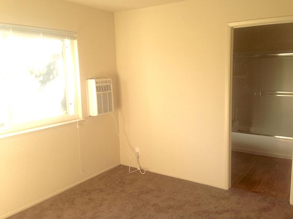 2nd Bedroom, view of bamboo, door to Master Bathroom.