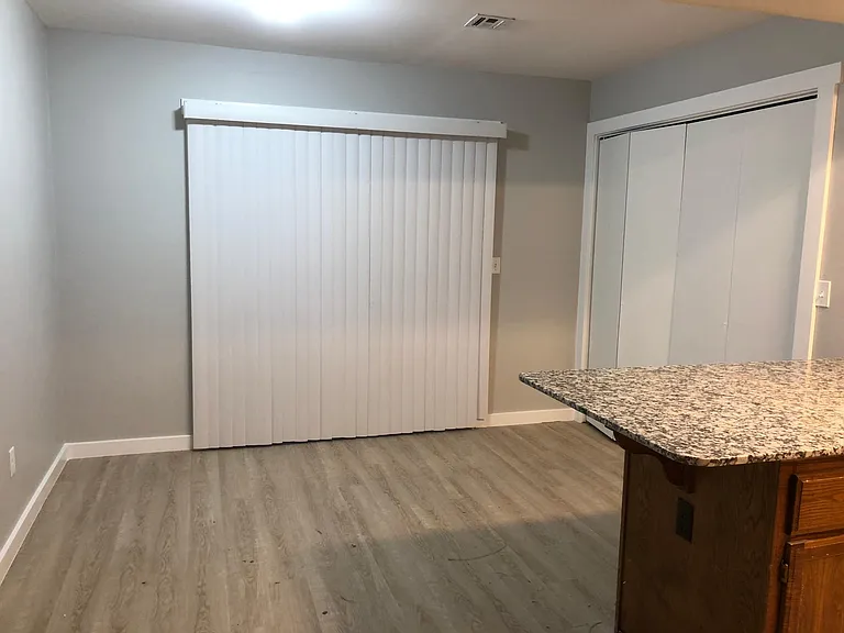 Patio sliding doors and laundry room inside the home