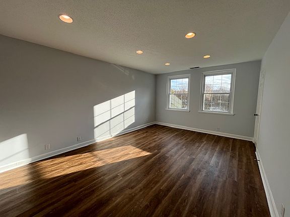 Spacious living room with recessed lights, located on 2nd floor with NO neighbors above!