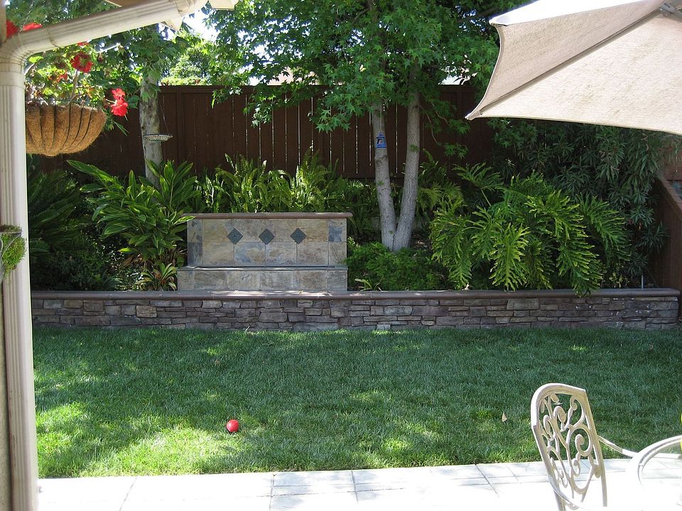 custom backyard foutain with wall for seating