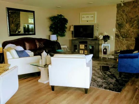 Comfy Living Room with Wood Burning Fireplace