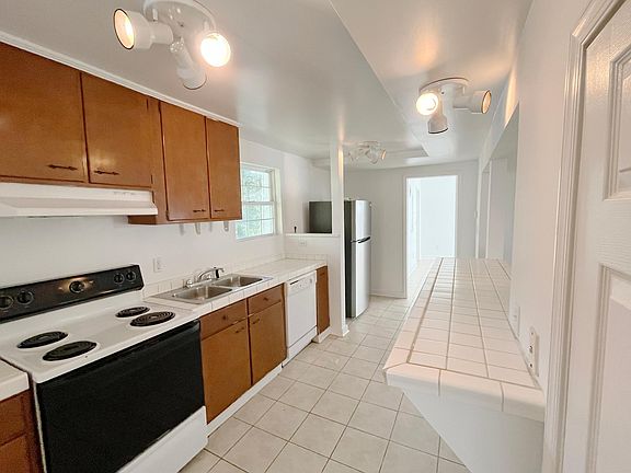 Kitchen with door to bedroom 1 in background