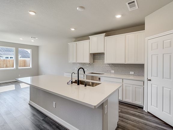 Kitchen. Note Sample product photo - actual exterior and interior selections may vary by homesite