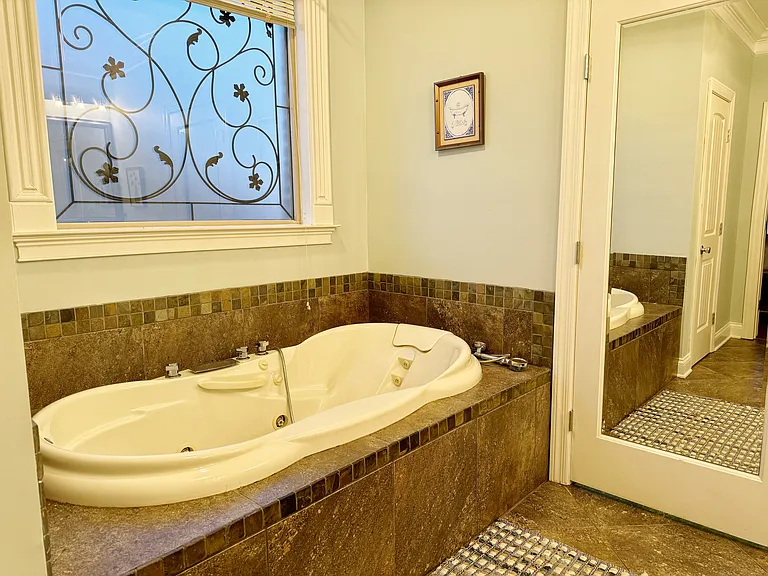 Large master bath with shower and separate tub.