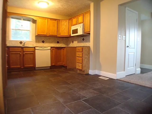 kitchen with plenty of cabinets plus a pantry
