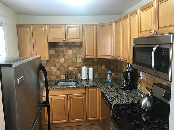 kitchen with stainless steel appliances, cookware, etc..