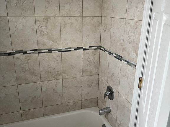Second bathroom with bath tub