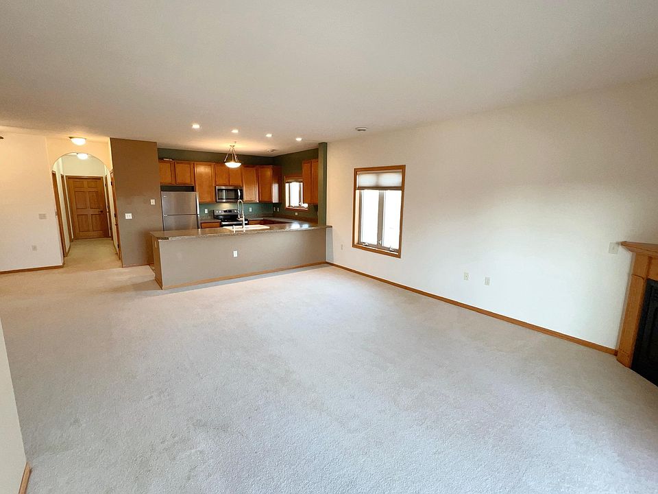 Open concept Living/Dining/Kitchen area with a large breakfast bar and 9-foot ceilings throughout