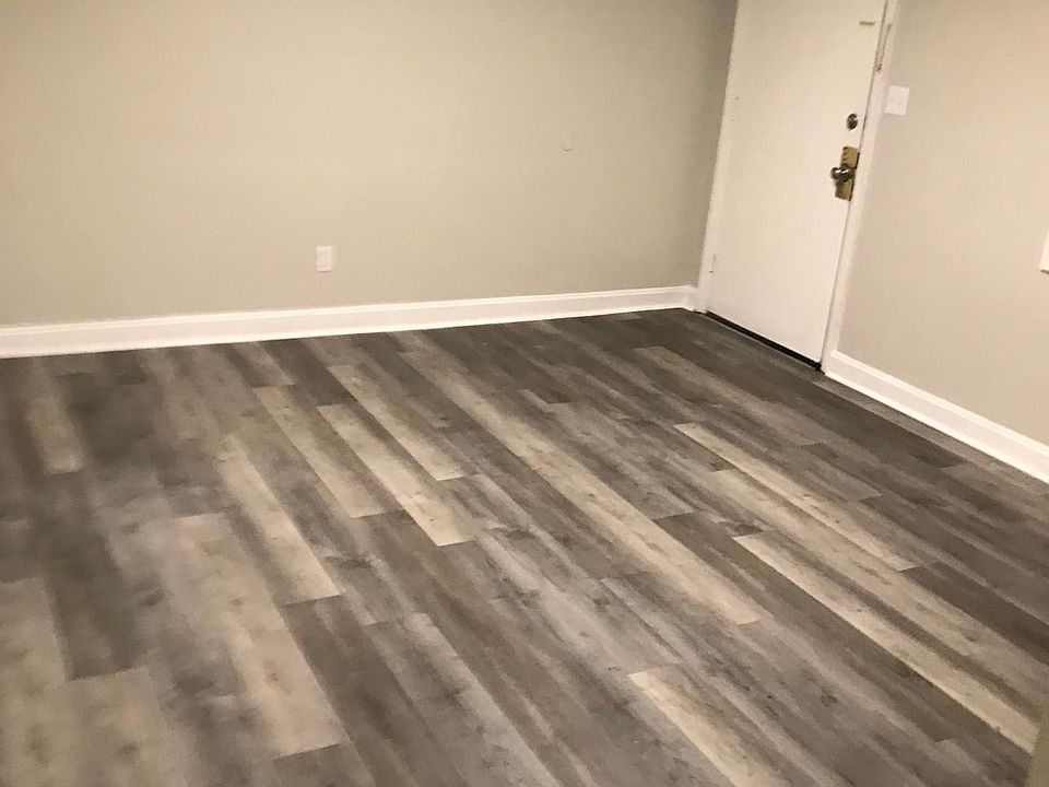 Updated Spacious Living Room w/ LVP Flooring and LED Lighting