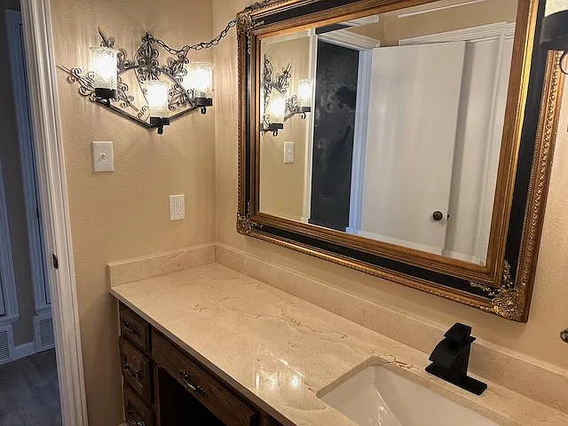 2nd bath with new granite countertop, sink and fixtures