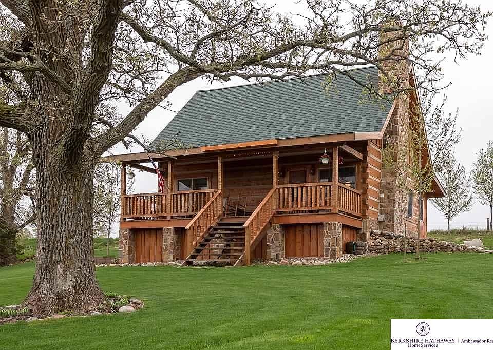 Enjoy quiet country living in this amazing StoneMill Log Home.