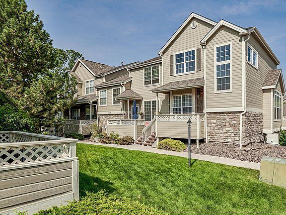 End unit with grassy knoll in between units