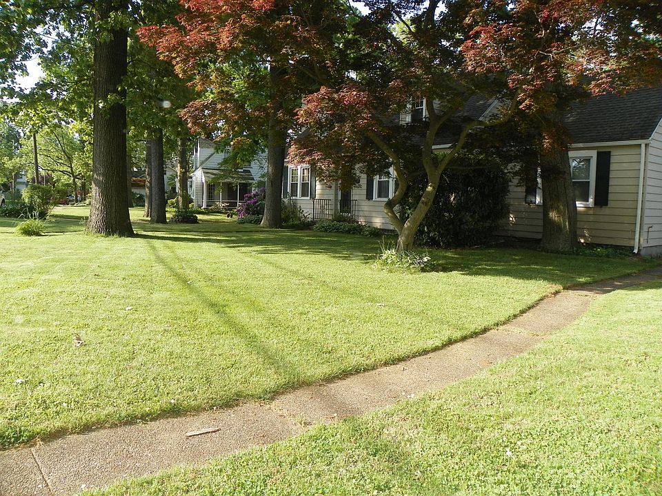 100 year old Oak Trees provide shade for 703 and 705