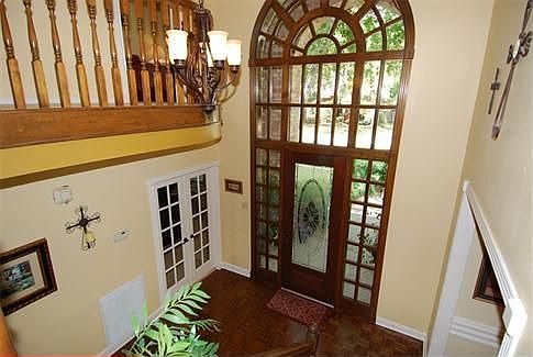 Outstanding craftsmanship throughout this custom home. Foyer features a two story entry with stunnin
