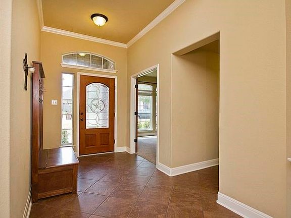 Spacious entry with oversized tile floors throughout
