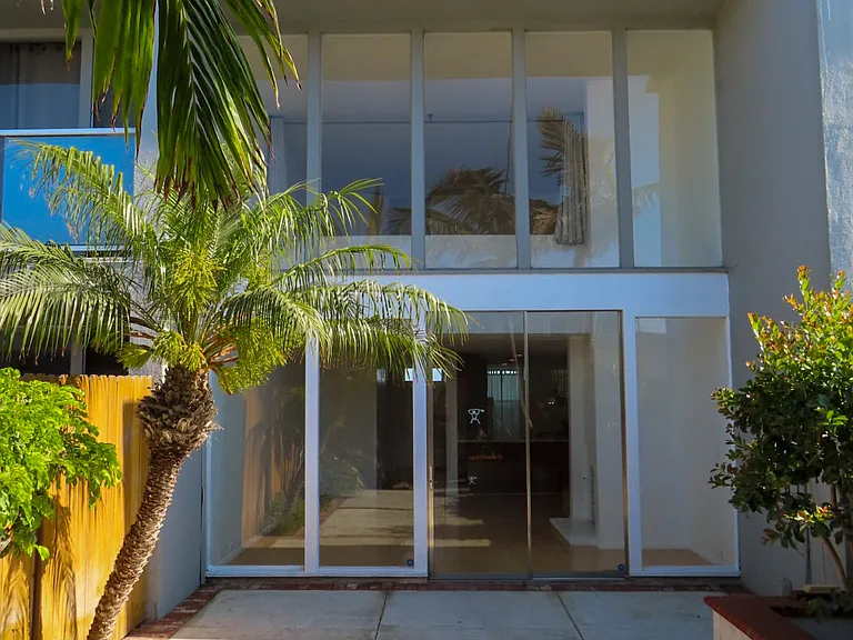 Backyard looking into condo living room