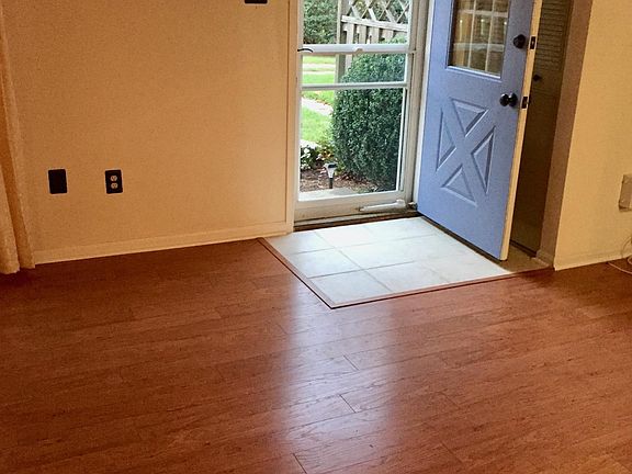 Walk into a nice living room and dining room combination space with laminate plank flooring.