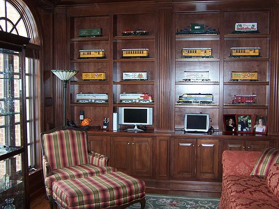 First Floor Den with wall of custom built ins