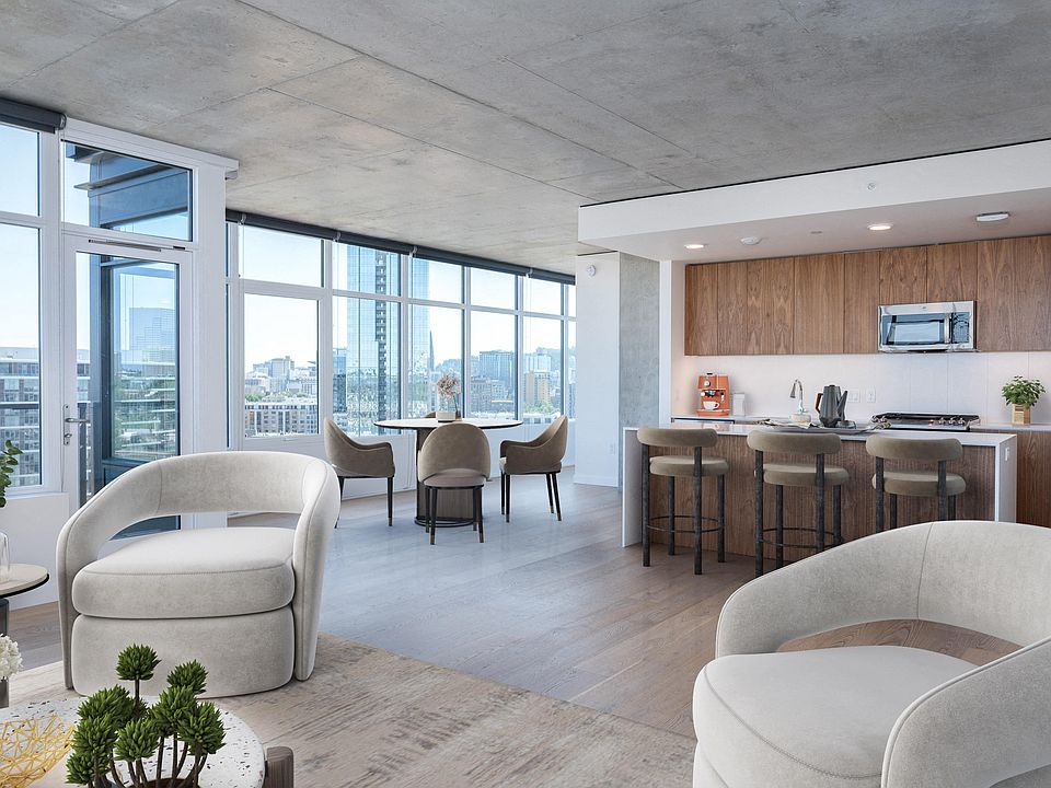 Beautifully designed interiors with high ceilings, oversized windows, and custom roller shades