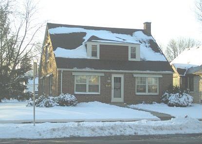 FRONT OF THE HOME - CHARMING BRICK CAPE COD HOME